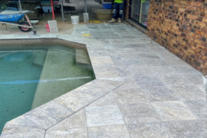 Pool tiling and waterline repair with specialized adhesives Sydney