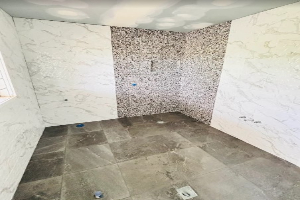 Level wall and floor tile installation using laser levels Sydney
